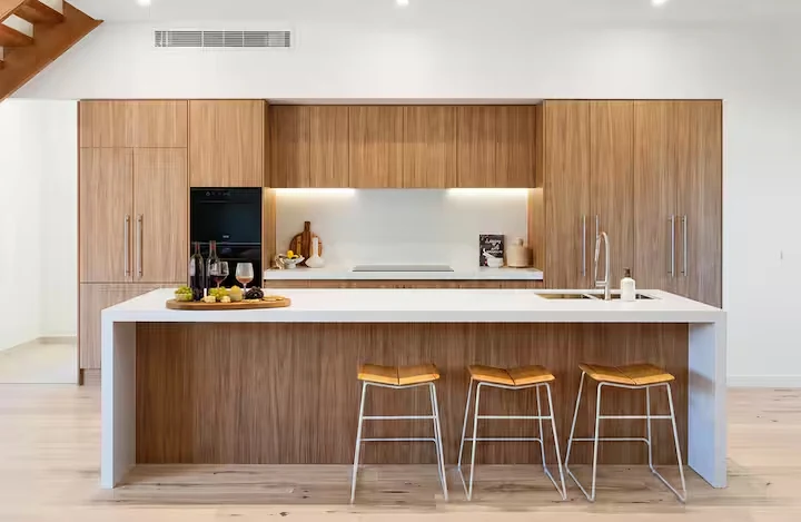 Timber kitchen with a large island and stools